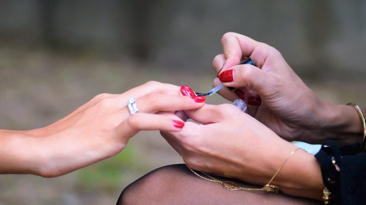 woman doing manicure